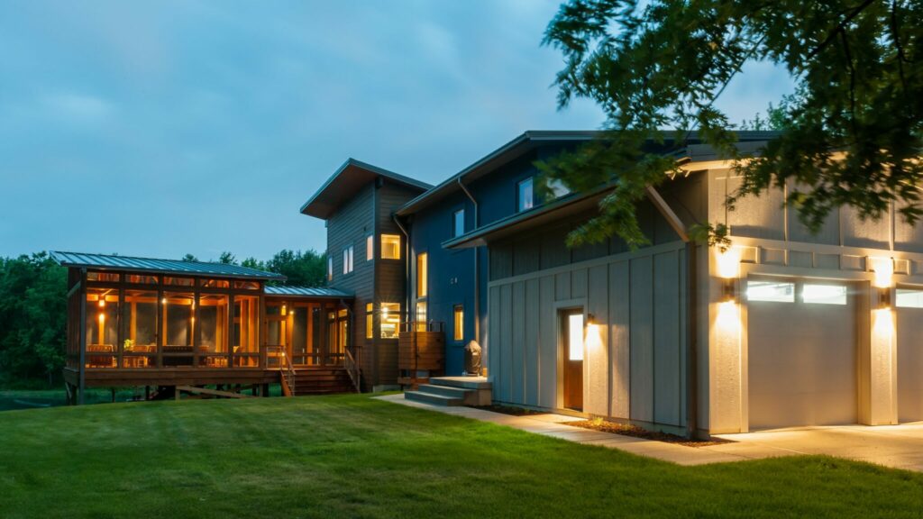 Photo of home with outdoor and indoor lighting